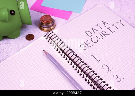 Sign displaying Data Security. Conceptual photo Confidentiality Disk Encryption Backups Password Shielding Important Message On Notebook On Desk With Money, Pen, Notes And Pig Box. Stock Photo