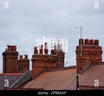 Clay chimney pots on rooftops Stock Photo