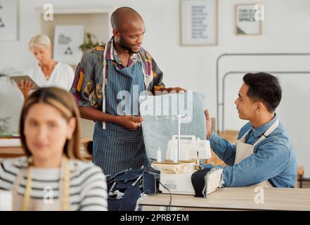 Talking, planning or discussing fashion designers deciding on fabric for making, stitching or sewing clothes. Workshop design or tailor team choosing cloth for trendy, stylish or fashionable clothing Stock Photo