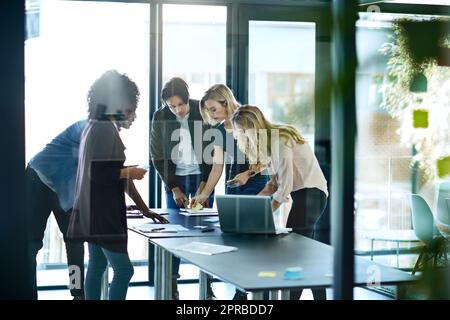 mMeting with team or group of businesspeople planning, brainstorming ideas and working on strategy for project in modern boardroom. Productive and diverse coworkers collaborating together Stock Photo