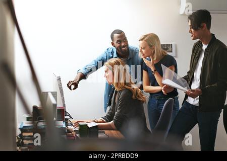 Group training, workshop and learning to brainstorm ideas and collaborate. Young diverse thinking and focused employees working as a team in the office. Coaching and feedback from staff in workplace. Stock Photo