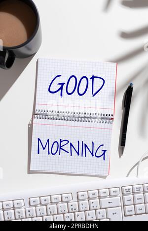 Writing displaying text Good Morning. Business showcase A conventional expression at meeting or parting in the morning Notebook With New Ideas On Both Sides On Desk With Coffee, Pen And Keyboard Stock Photo