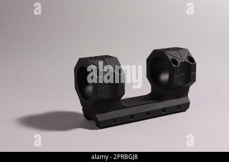 Quick disconnect sniper cantilever scope mount on grey background Stock Photo