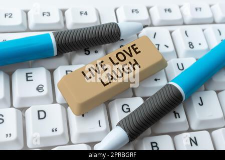 Conceptual caption Live Love Laugh. Word for Be inspired positive enjoy your days laughing good humor -48579 Stock Photo