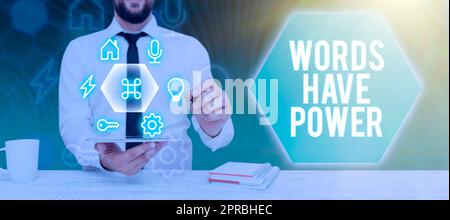 Inspiration showing sign Words Have Power. Word for Energy Ability to heal help hinder humble and humiliate Businessman Holding Tablet And Presenting Crutial Messages In Office. Stock Photo