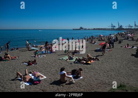 Malaga, Spain. 26th Apr, 2023. Bathers are seen sunbathing at 'La Malagueta' beach as they enjoy the good weather amid an unusual heat wave. Spain is experiencing an unusual episode of high temperatures in April, months before the beginning of summer. According to the Spanish State Meteorological Agency, temperatures of over 35 degrees will be reached in most of the country. (Credit Image: © Jesus Merida/SOPA Images via ZUMA Press Wire) EDITORIAL USAGE ONLY! Not for Commercial USAGE! Stock Photo