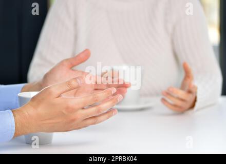 Two friends hands talking in a bar Stock Photo