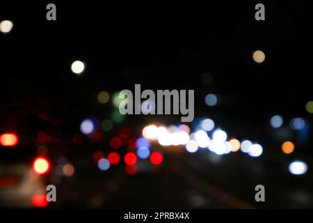 traffic in the city night Circular colorful bokeh light, abstract blur defocused background. Stock Photo