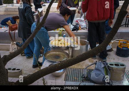 People preparing food on the street in Paris, france.March 24, 2023. Stock Photo