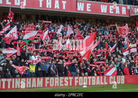 Nottingham, UK. 26th Apr, 2023. Nottingham Forest fans wave flags during the Premier League match Nottingham Forest vs Brighton and Hove Albion at City Ground, Nottingham, United Kingdom, 26th April 2023 (Photo by Gareth Evans/News Images) in Nottingham, United Kingdom on 4/26/2023. (Photo by Gareth Evans/News Images/Sipa USA) Credit: Sipa USA/Alamy Live News Stock Photo