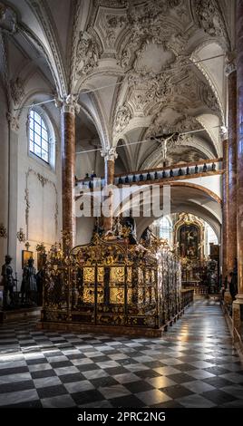 Bronze statues flank the the cenotaph of Maximilian I at the Hofkirche in Innsbruck Austria looking toward the High Altar Stock Photo
