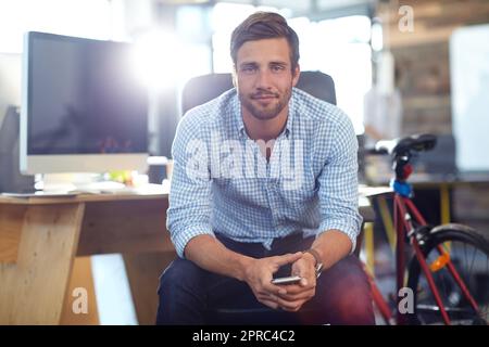 Be positive, patient and persistent. Portrait of a young designer at work in an office. Stock Photo