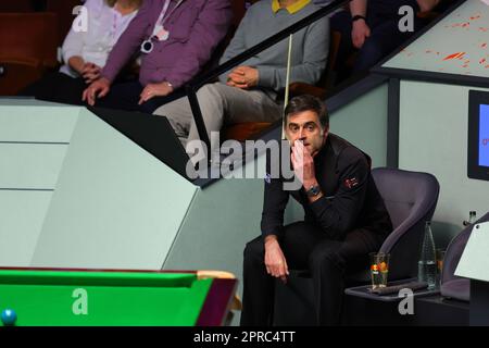 Sheffield, Britain. 26th Apr, 2023. Ronnie O'Sullivan of England reacts during the quarterfinal against Luca Brecel of Belgium at the World Snooker Championship in Sheffield, Britain, April 26, 2023. Credit: Zhai Zheng/Xinhua/Alamy Live News Stock Photo