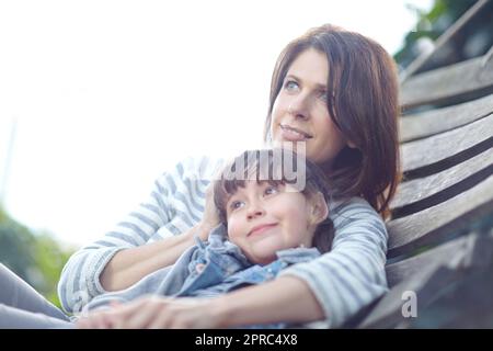 Enjoying the view. a mother and daughter lying together on a hammock. Stock Photo