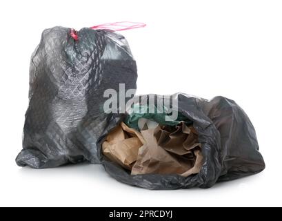 Garbage bags with different trash isolated on white background Stock Photo