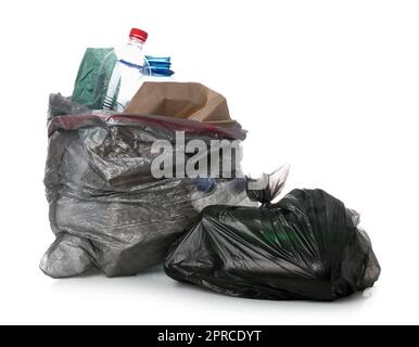 Garbage bags with different trash isolated on white background Stock Photo