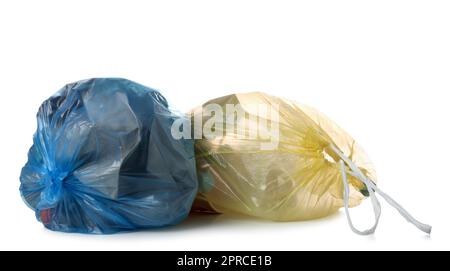 Garbage bags with different trash isolated on white background Stock Photo