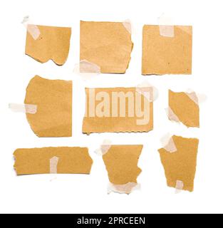 Attached pieces of torn paper sheets isolated on white background Stock Photo