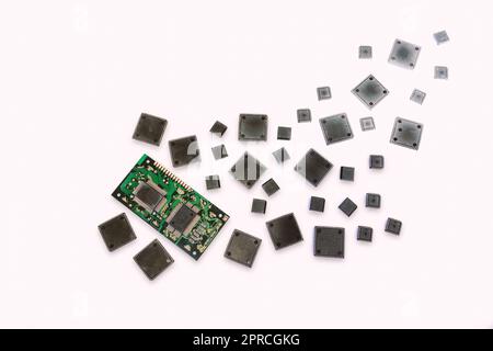 electronic components microchips and printed circuit board on white background. Border. Copy space. Stock Photo