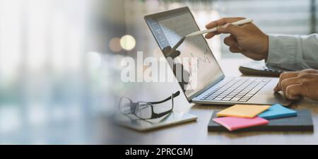 Business data dashboard analysis by a man using computer graphs on a virtual screen Business strategy Stock Photo