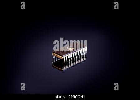 one single Integrated circuit isolated on black background. Stock Photo