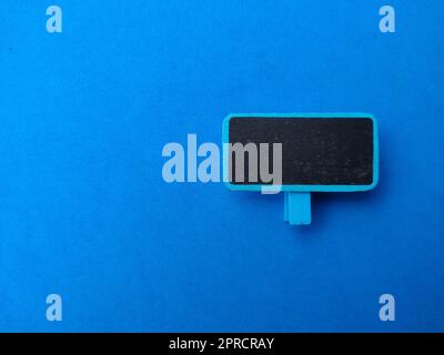 Colored wooden board on a blue background. The concept of copy space for writing Stock Photo