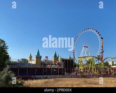 Giant ferris wheel in Amusement park with blue sky background. Stock Photo