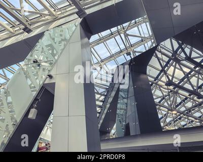 ceiling in a glass building on metal supports. glass ceiling, modern loft style. fashion house design, transparent roof. strong metal supports. Stock Photo