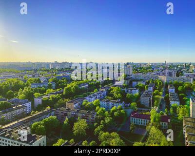 panoramic view of the city. beautiful tall houses, a green park, comfortable housing for people. view from high floor. nature and clear sky, concrete Stock Photo