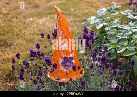 garden deco in lavender bed Stock Photo