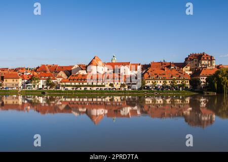 Lent district in Maribor, Slovenia. Popular waterfront promenade with historical buildings and the oldest grape vine in Europe. Stock Photo