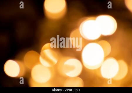 Shiny Christmas lights bokeh background with sparkling bokeh as blurry background for celebration party disco glitter or Christmas eve and a happy new year atmosphere with shining lights and circles Stock Photo