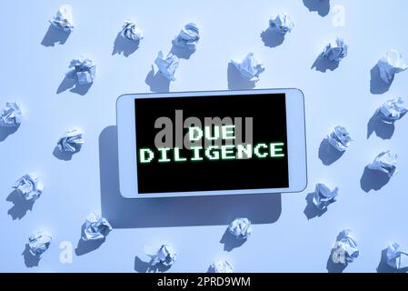 Text showing inspiration Due Diligence. Business approach Comprehensive Appraisal Voluntary Investigation Audit Paper Wraps Placed Around Tablet With Important Informations. Stock Photo