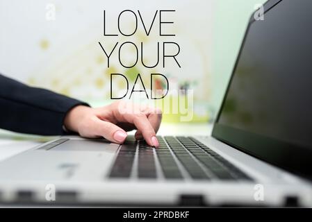 Text showing inspiration Love Your Dad. Word Written on Have good feelings about your father Loving emotions Businesswoman Typing Recent Updates On Lap Top Keyboard On Desk. Stock Photo