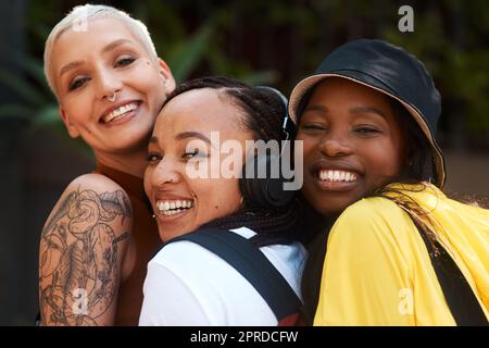 Well grow old together. three close friends spending the day together in the city. Stock Photo