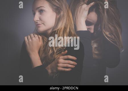Depressed mid-aged woman at home feeling sad, lonely, anxious (color toned image) Stock Photo