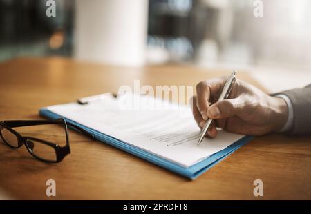 Lawyer hand showing paperwork for signing, agreement contract and settlement offer in law firm office. Closeup of legal advisor, attorney and paralegal pointing with pen to accept or close court case Stock Photo