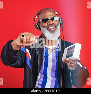 They dont make music like this anymore. a mature man listening to music through headphones. Stock Photo