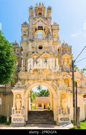 Large extraordinary gateway in the Buddhist monastery Sunandarama Maha Vihara in Sri Lanka Stock Photo