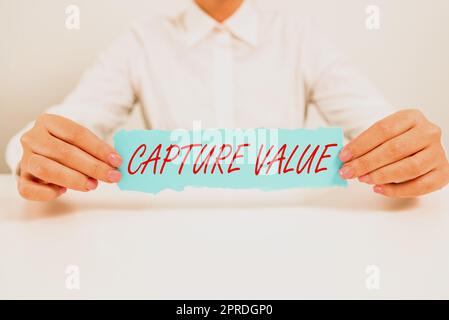 Inspiration showing sign Capture Value. Business concept Customer Relationship Satisfy Needs Brand Strength Retention Businesswoman Holding Note With Important Message On Office Desk. Stock Photo