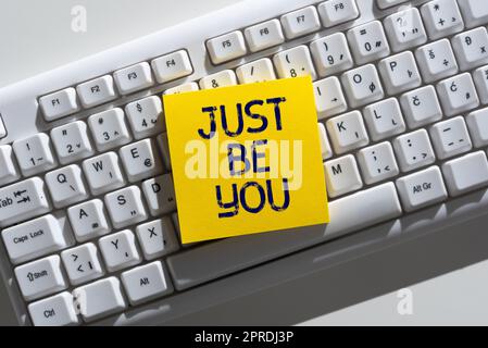 Writing displaying text Just Be You. Business concept Keep being authentic unique yourself Motivation Inspiration Important Informations Written On Note On Desk Above Keyboard. Stock Photo