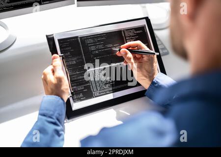 Web Developer Looking At Code Stock Photo