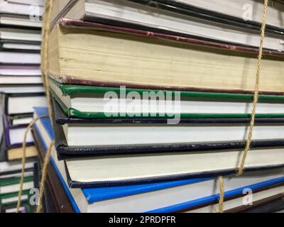 Pile of old books with rope background Stock Photo