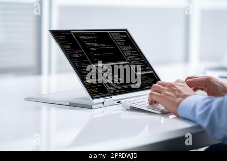 Computer Programmer Using Development Software Stock Photo