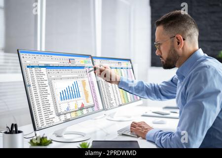 Analyst Working With Spreadsheet Business Data Stock Photo