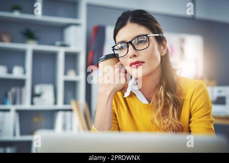 Dont quit your daydream. an attractive young fashion designer in her workshop. Stock Photo