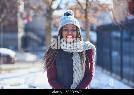 young woman in winter clothes in hats outdoors There is a lot of