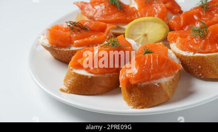 Open sandwiches with trout fillet ,wheat bread with butter and herbs Stock Photo