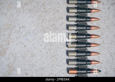 Machine gun belt loaded with cartridges Stock Photo