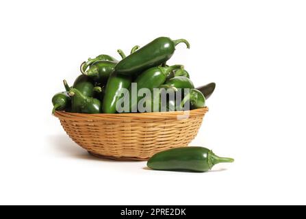 Basket of Fresh Picked Jalapeno Peppers Isolated on White Background Stock Photo